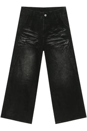 Faded black palazzo jeans in distressed denim with a wide leg.