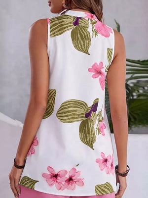 White floral v-neck sleeveless top with pink flowers and green leaves.
