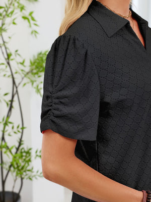 Black eyelet ruched short sleeve blouse with a collared neckline.