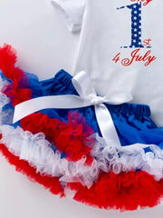 Baby outfit with white top saying 1st 4 July and red, white, blue ruffled tutu skirt.