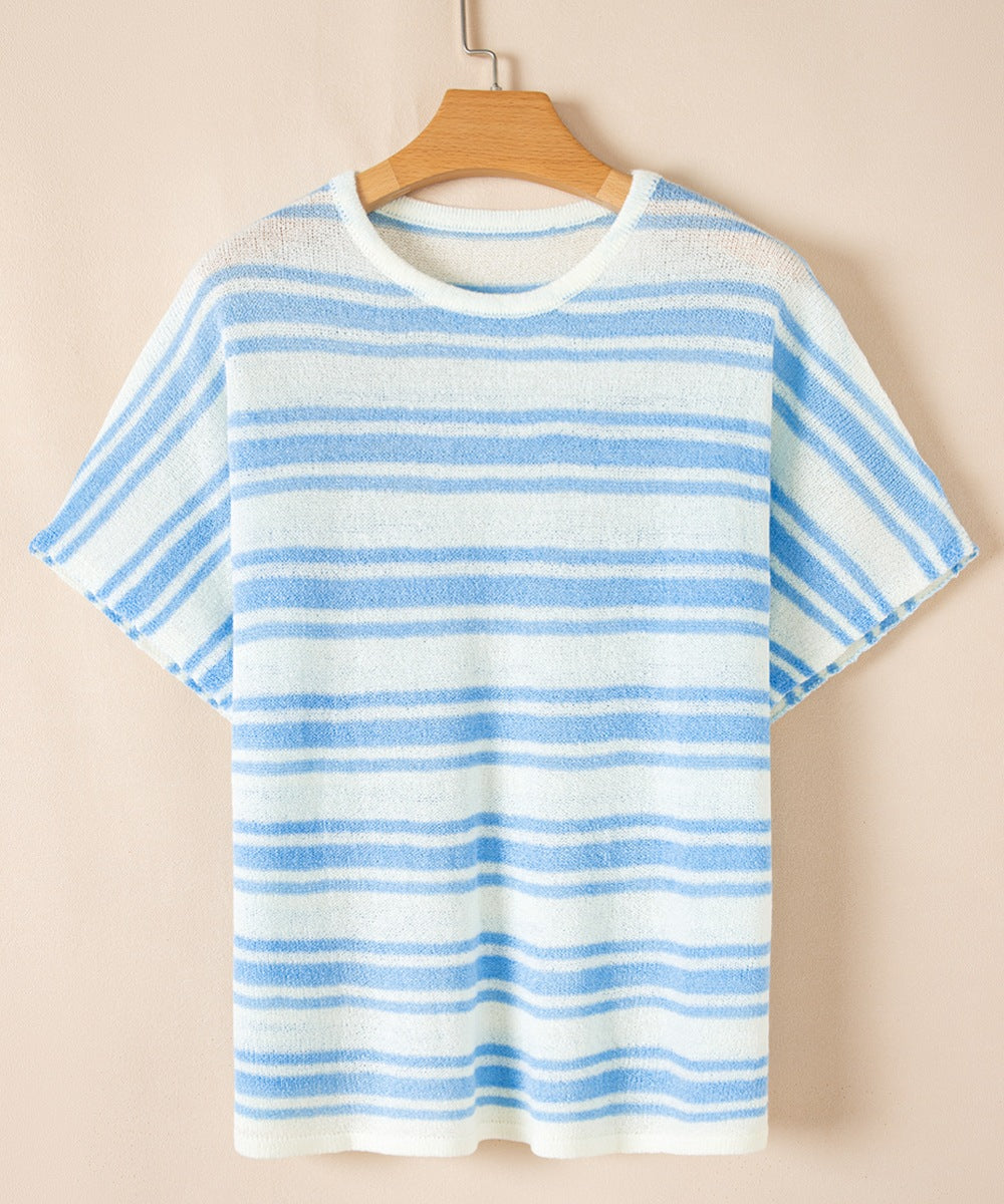 Boxy light blue and white striped knit t-shirt with short sleeves and a crew neck.