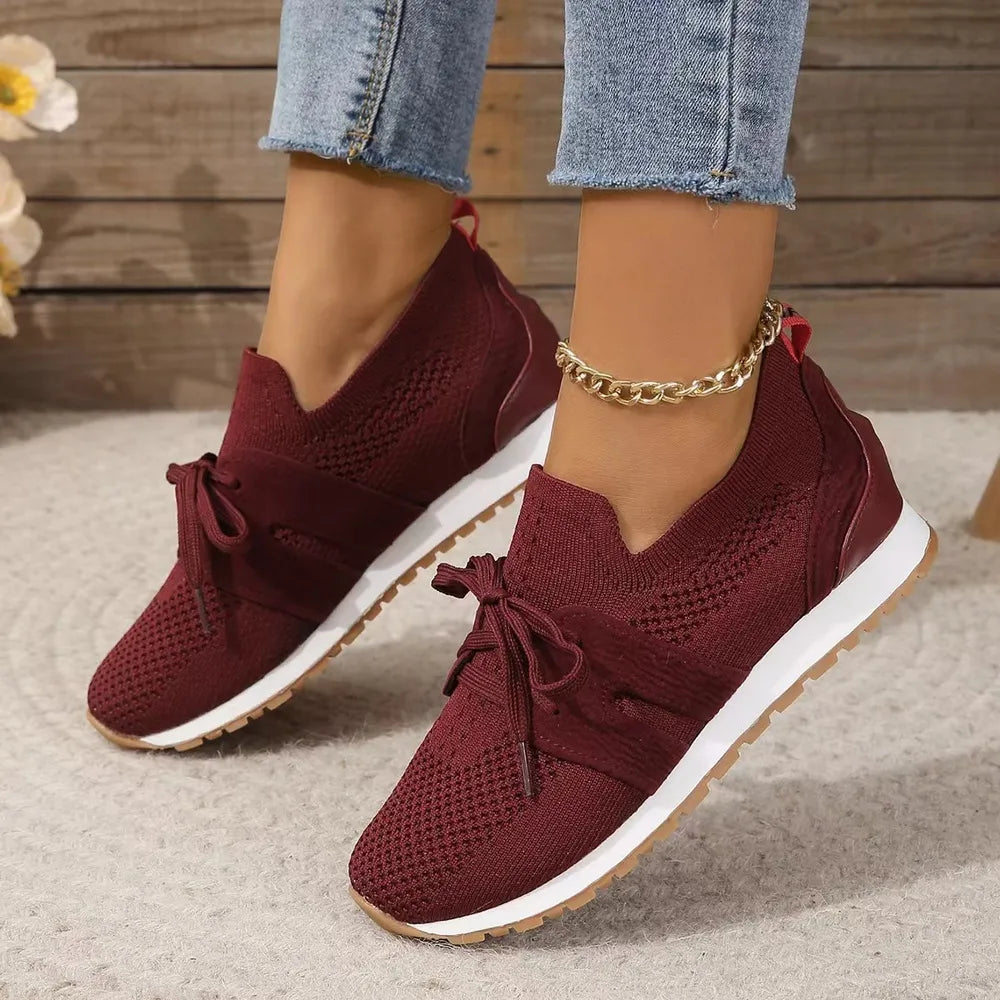 Burgundy knit & suede lace-up sneakers with white soles and a gold anklet.