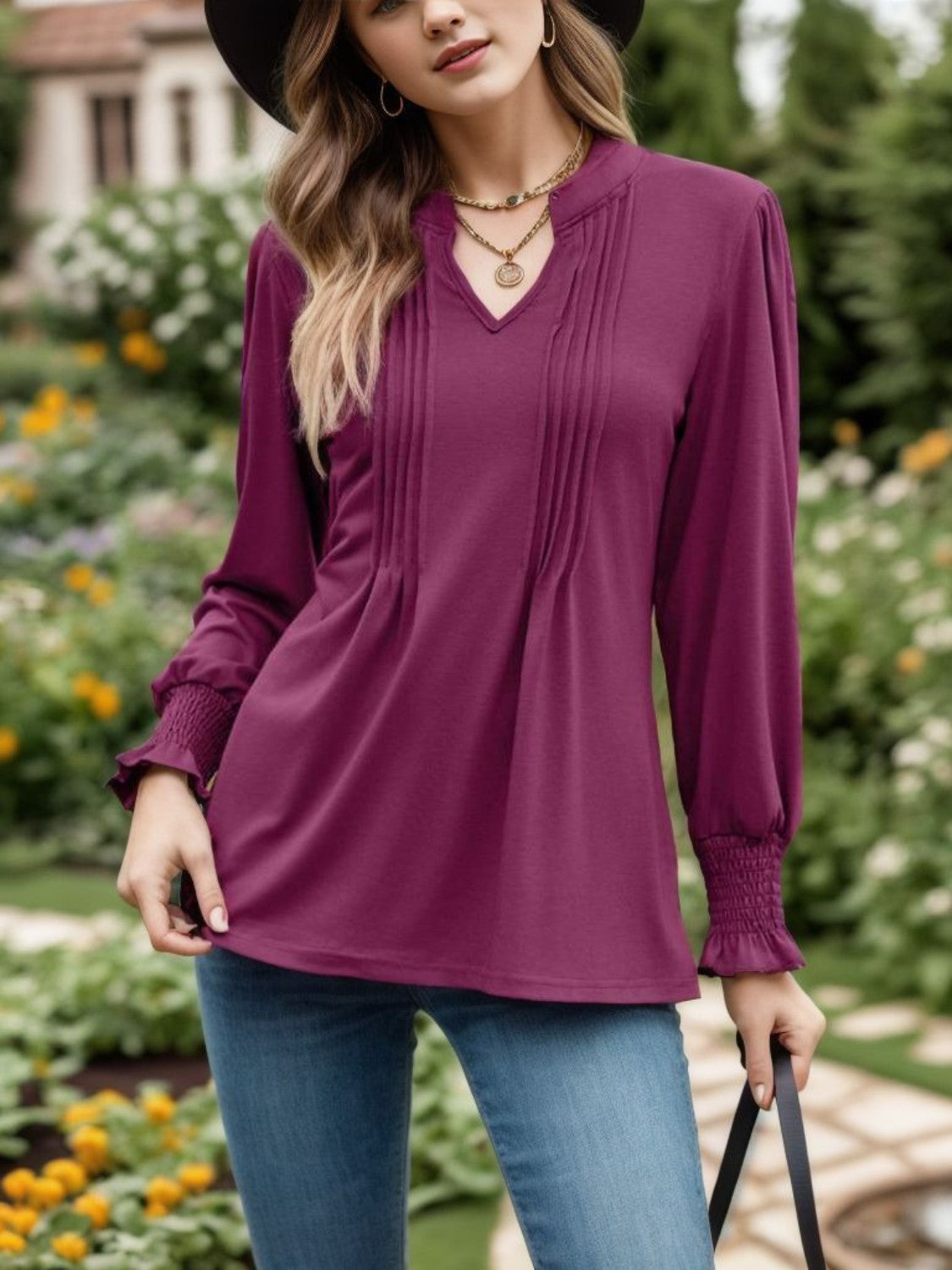 Deep purple long sleeve blouse with pleated yoke and gathered cuffs