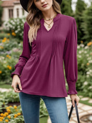 Deep purple long sleeve blouse with pleated yoke and gathered cuffs