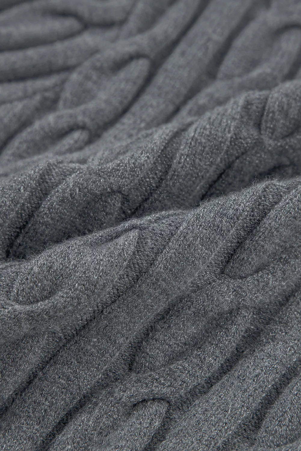 Dark gray cable knit sweater with textured detail
