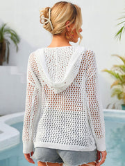 White crochet knit hoodie with a hood and long sleeves, showing a sheer back detail.