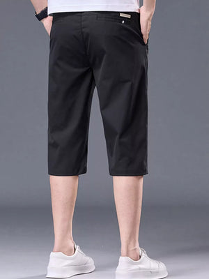Men's black chino shorts with pockets and belt loops.