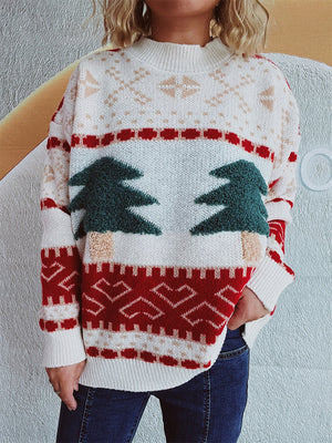 Beige knit sweater with festive appliqué Christmas trees, snowflakes, and geometric patterns.