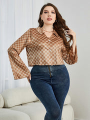 Retro checkered bell sleeve blouse in plaid with buttoned front, styled casually.