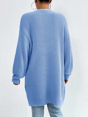 Longline knit open cardigan in Misty Blue acrylic with ribbed texture and long sleeves.