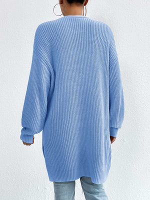 Longline knit open cardigan in Misty Blue acrylic with ribbed texture and long sleeves.