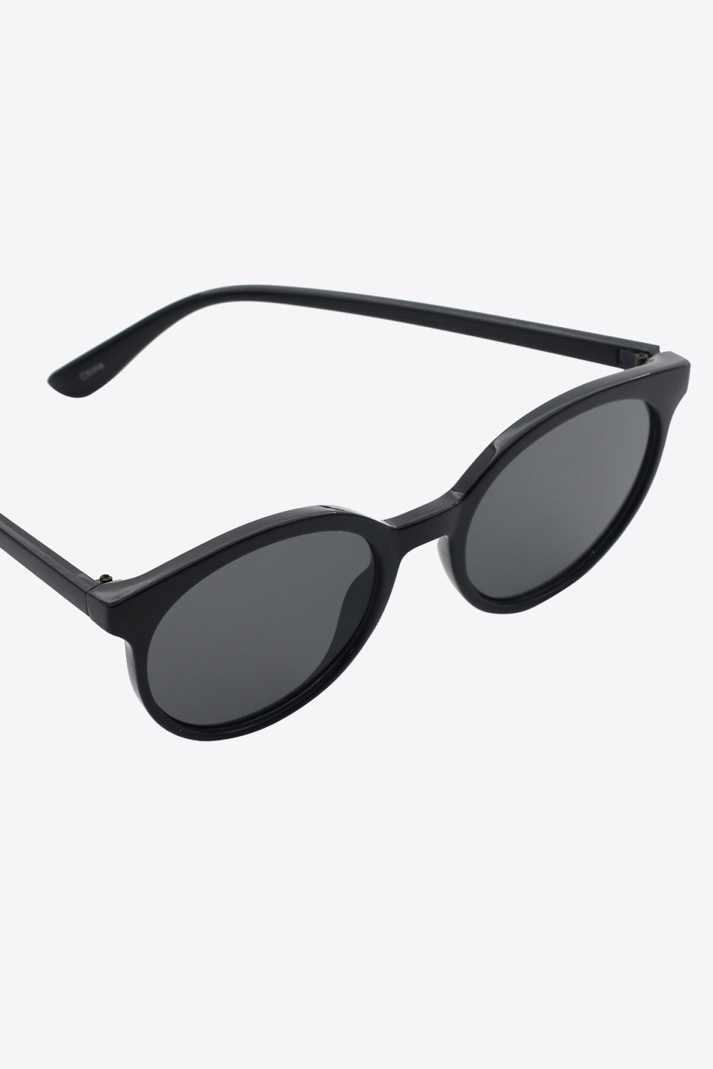Black round frame sunglasses with dark lenses