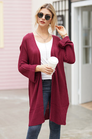 Burgundy open-front maxi knit cardigan with textured acrylic fabric and ribbed cuffs.
