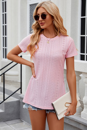 Blush pink crewneck top with eyelet details and side slits.