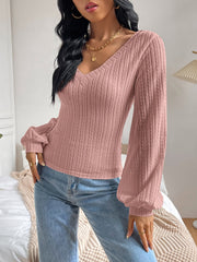 Dusty pink textured chevron sleeve blouson top with V-neck and balloon sleeves.