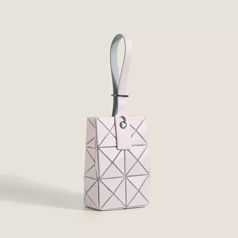 Blush pink geometric panel tote bag with a single handle and silver hardware detail.