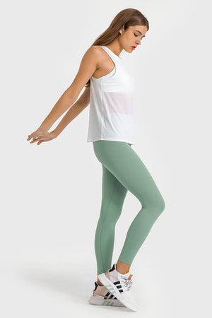 Green high-waist performance leggings with a full-length cut.