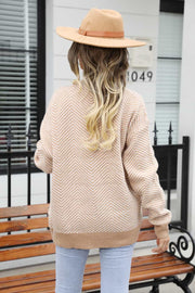 Chevron knit cardigan in tan with contrast trim and button front, acrylic material.