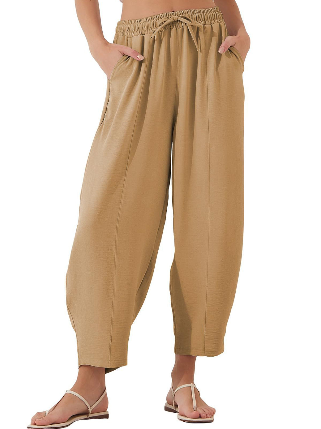 Camel balloon-leg drawstring trousers with seam detail and pockets.