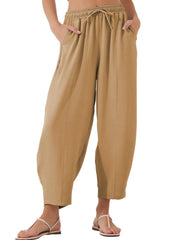 Camel balloon-leg drawstring trousers with seam detail and pockets.