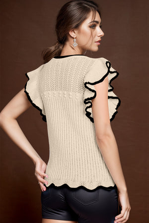 Khaki knit top with black scalloped trim on ruffled sleeves and hem.