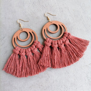 Macrame tassel and wood circle earrings in strawberry with knotted fringe detail.