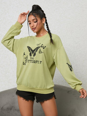 Lime butterfly graphic oversized sweatshirt with crew neck and long sleeves.