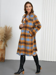 Belted bouclé overcoat in plaid pattern with blue and orange tones, featuring a notched lapel and button closure.