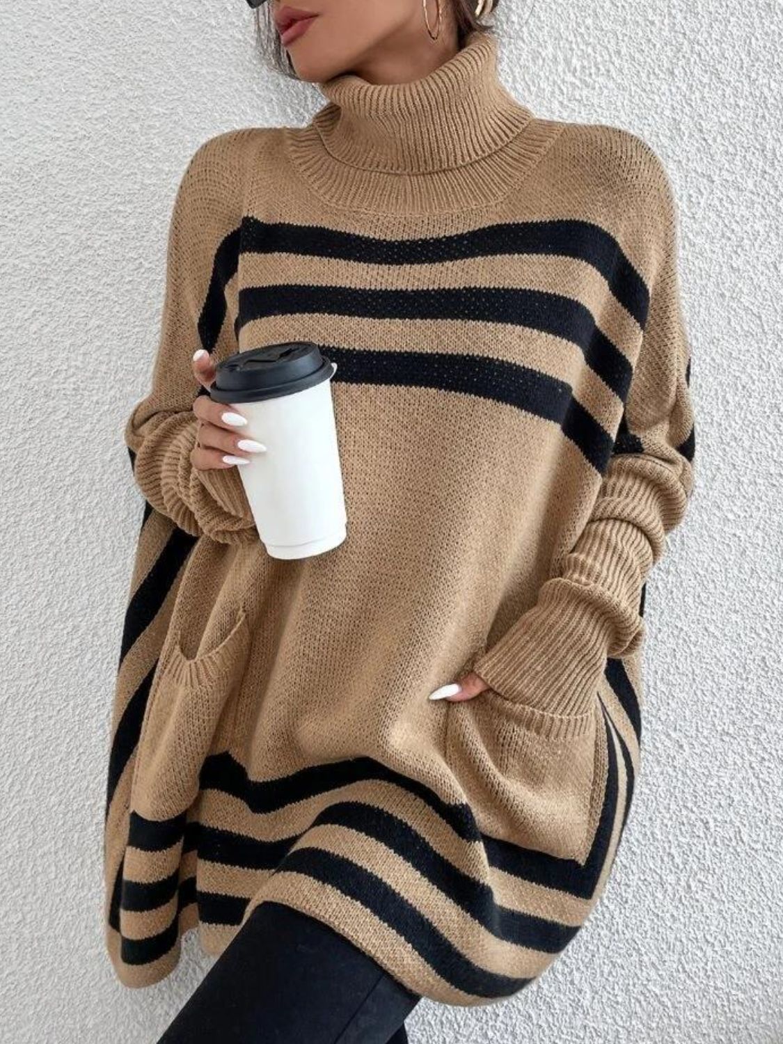 Tan geometric stripe acrylic poncho sweater with turtleneck and pockets