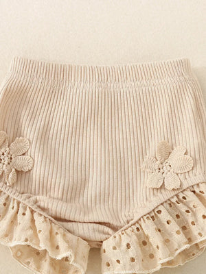 Apricot cotton baby bloomers with eyelet ruffle trim and flower appliques.