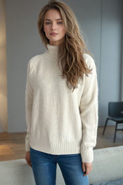 Cream speckled Donegal turtleneck sweater with ribbed cuffs and hem.