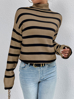 Oversized camel and black striped turtleneck sweater with ribbed cuffs.
