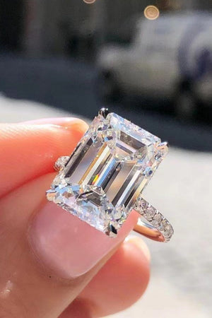 Sparkle Luxe Moissanite Halo Ring in silver with a large emerald-cut center stone and pavé band.