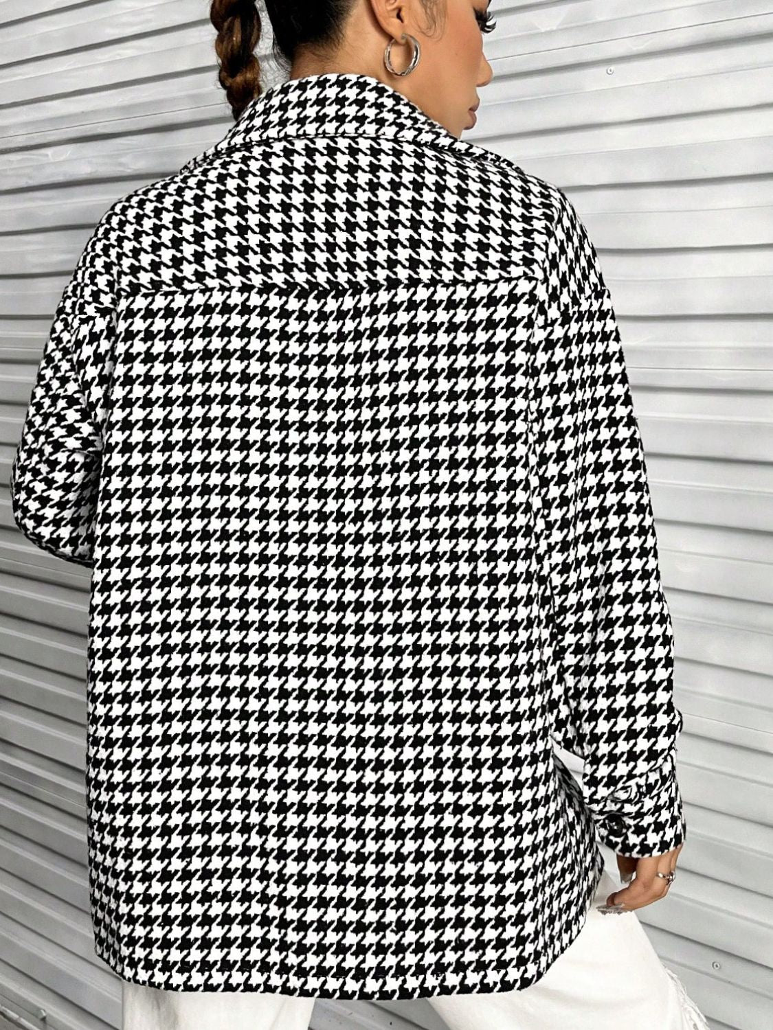 Black houndstooth overshirt with a classic collar and button cuffs.