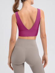 Sculpted backless crop top in Red-Violet with a deep V-neckline and wide band.