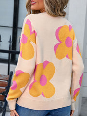 Ivory oversized knit sweater with large yellow and pink floral print.