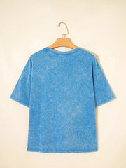 Mineral washed blue cotton crew neck oversized t-shirt with short sleeves.