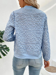 Light blue bomber jacket with textured mesh and a checkered pattern.