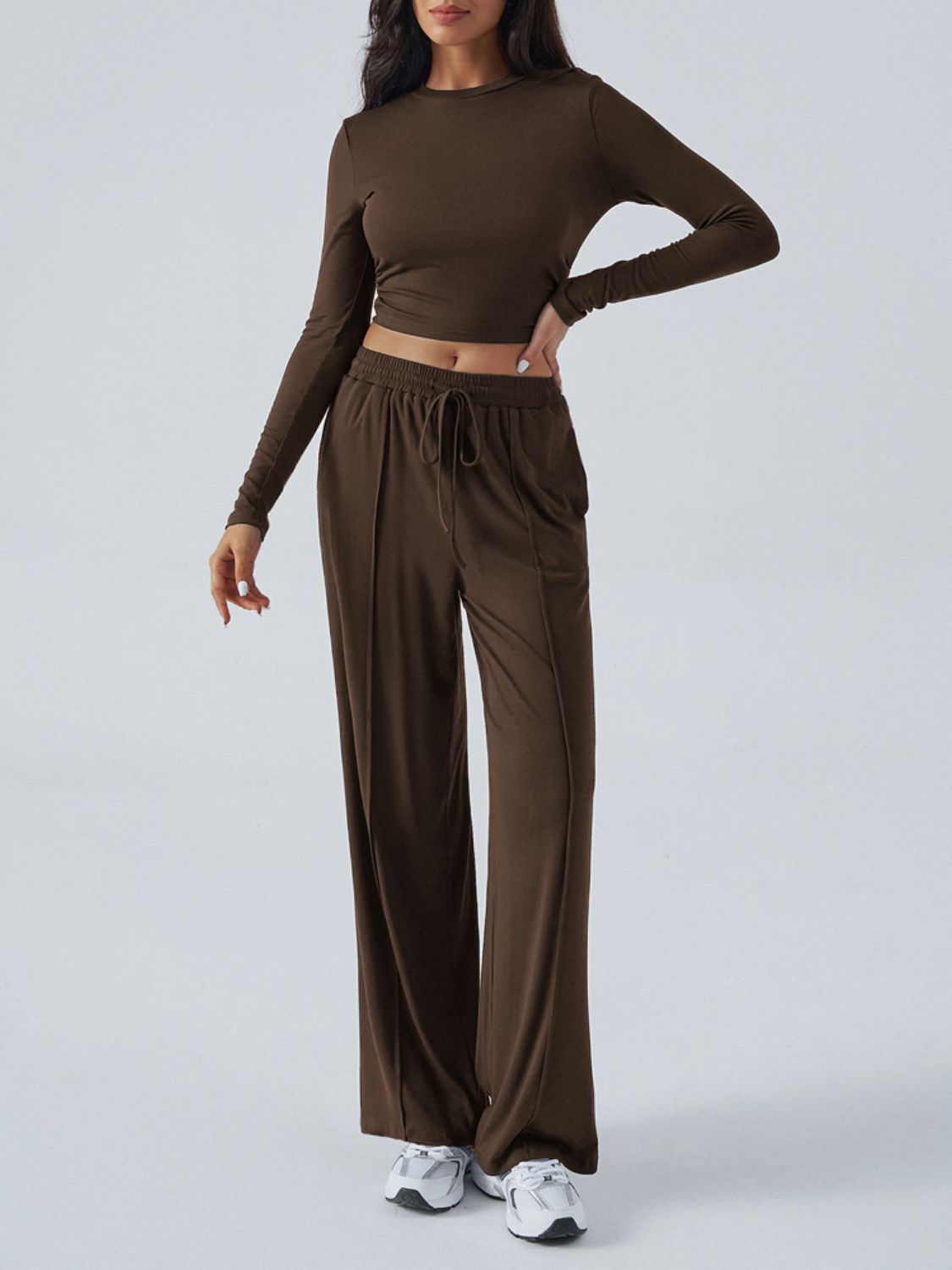 Ribbed knit crop top and wide leg pants set in coffee brown with drawstring waist.