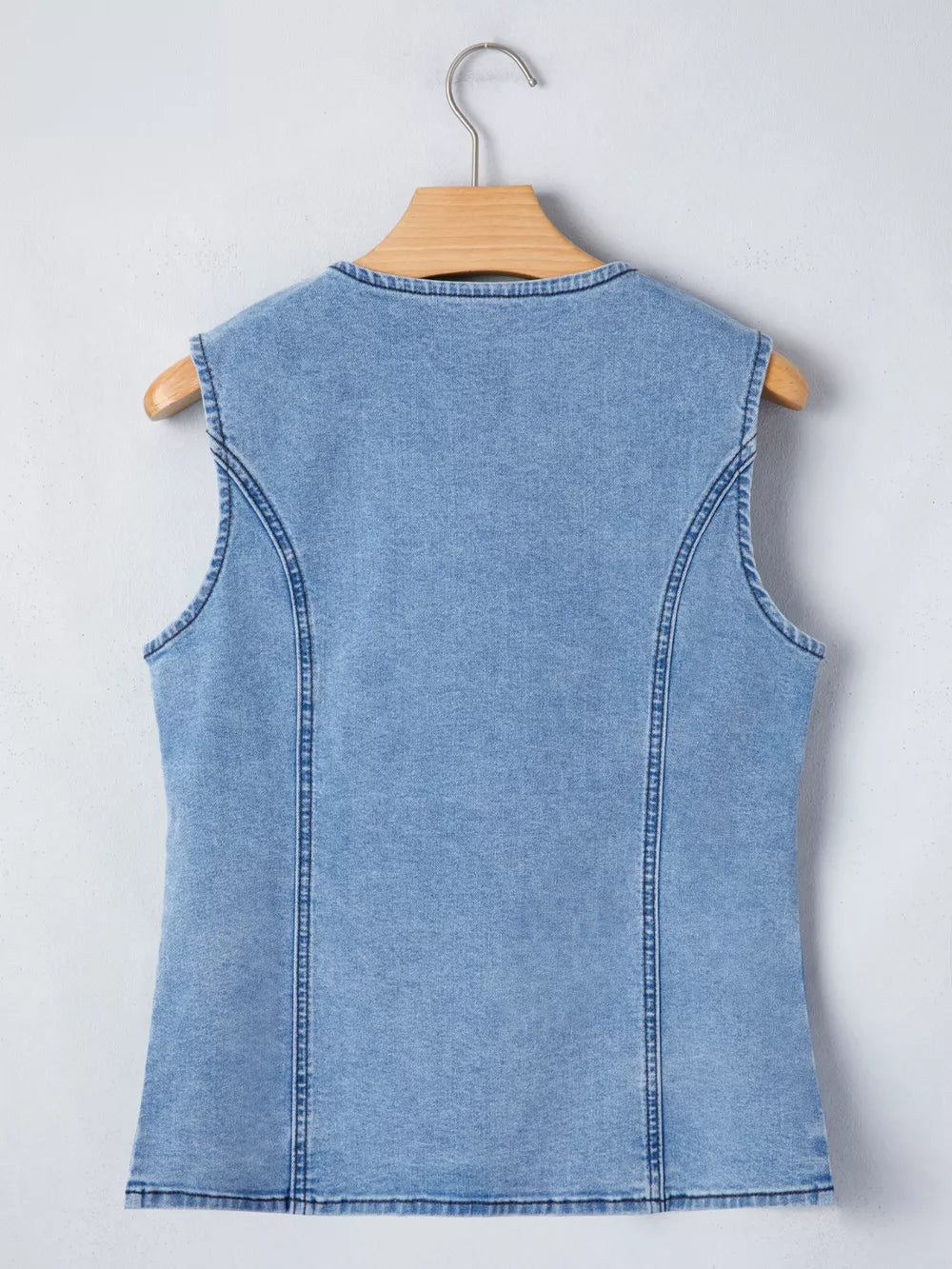 Light wash denim vest with button detail and slit, women's outerwear
