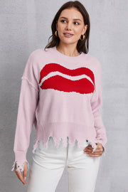 Pink knit sweater with red kiss graphic and distressed hem