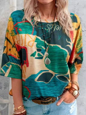 Casual t-shirt with brushstroke stripe pattern in yellow, green, blue, and orange.