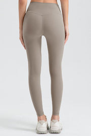 Women's high-waisted sculpted contour leggings in Khaki with V-seam detail.