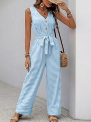 Striped tie-waist wide leg romper in light blue with decorative buttons and a v-neck.