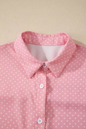 Pink polka dot button-up shirt with a collared neckline.