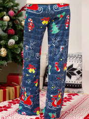 Festive print wide-leg lounge trousers in blue with Christmas motifs like reindeer, sleighs, and candy canes.