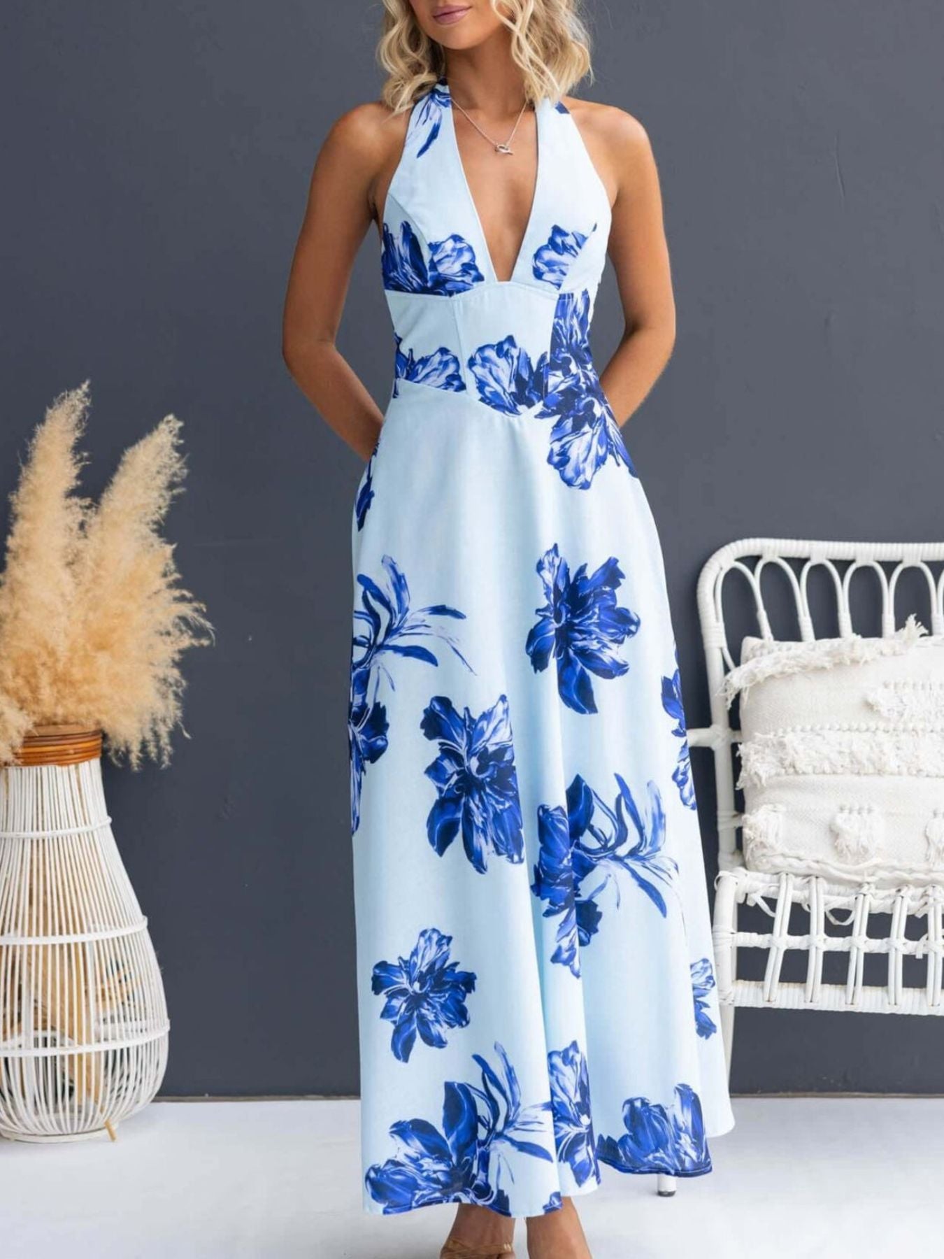 Light blue floral halter maxi dress with a deep V-neck and a-line skirt.
