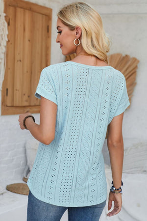 Light blue perforated eyelet cuffed tee with short sleeves and a relaxed fit.