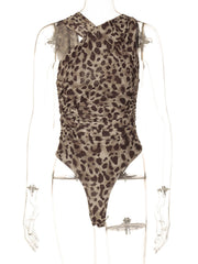Asymmetrical neck ruched bodysuit with leopard print and cutout detail.