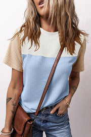 Panelled ribbed tee in light blue, white, and tan with textured sleeves.